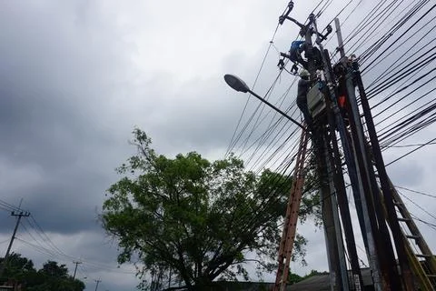 Electrician doing electrical repairs Stock Photos