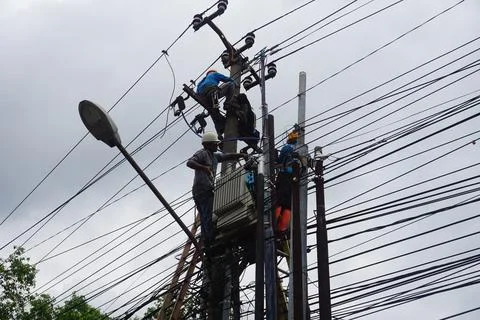 Electrician doing electrical repairs Stock Photos