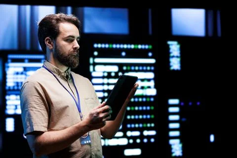 Electrician doing server system querying Stock Photos