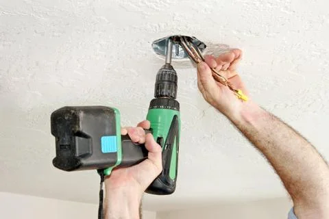 Electrician With Drill Stock-Fotos