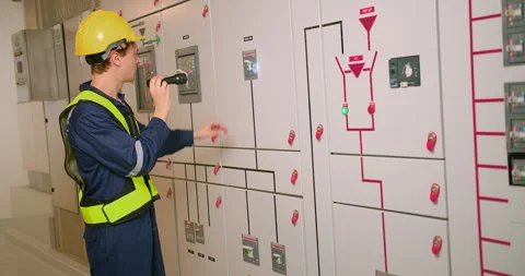 Electrician electrical engineer in protective uniform checking voltage control p Stock Footage 276394680