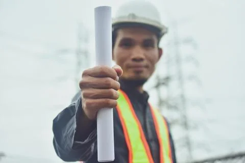 Electrician engineer High voltage post or high voltage tower background Stock-Fotos