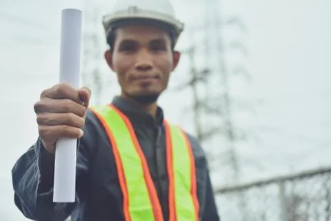 Electrician engineer High voltage post or high voltage tower background Stock Photos