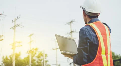 Electrician engineer High voltage post or high voltage tower background Stock Photos