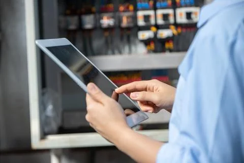 Electrician Engineer using  software check service maintenance electricity .. Stock Photos