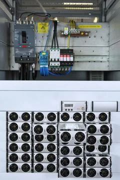 Electrician engineer work tester measuring voltage and current of power elect Stock Photos