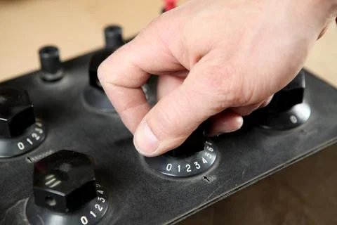 Electrician engineer work tester measuring voltage and current of power elect Stock Photos