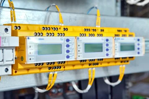 Electrician engineer work tester measuring voltage and current of power elect Stock Photos