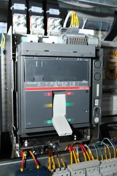Electrician engineer work tester measuring voltage and current of power elect Stock Photos