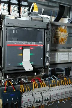 Electrician engineer work tester measuring voltage and current of power elect Stock Photos