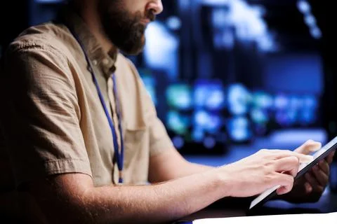 Electrician examining supercomputers Stock Photos