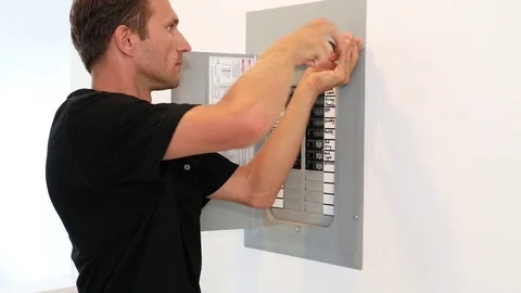 Electrician fixing electric panel in private home Stock Footage 71837157