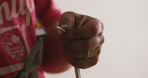 Electrician Folding Utility Knife After Electrical Work Stock Footage 341497422