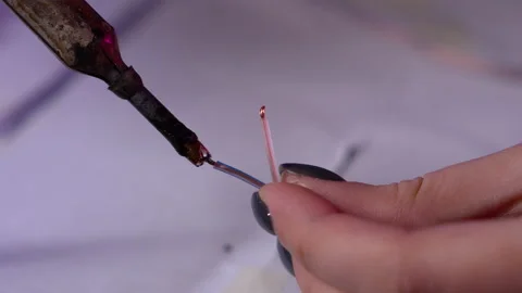 Electrician hands close up. The master professionally works with a soldering Stock Footage 145625795