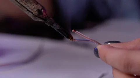Electrician hands close up. The master professionally works with a soldering Stock Footage 145625900