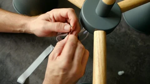 Electrician hands connecting wires assembling chandelier Stock Footage 321739398