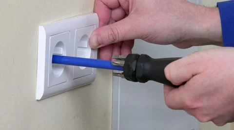 Electrician hands install electrical wall sockets Stock Footage 65263027