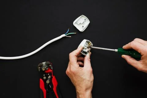 Electrician has plug opened Stock Photos