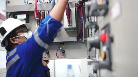 Electrician is inspecting the control equipment Stock Footage 164928463