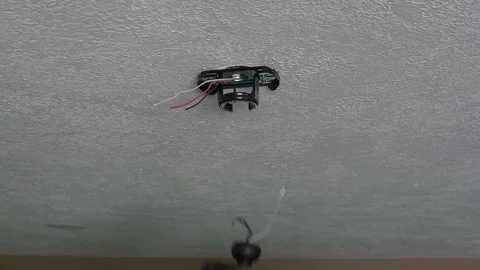 An electrician installing a ceiling fan in a home Stock Footage 106793192