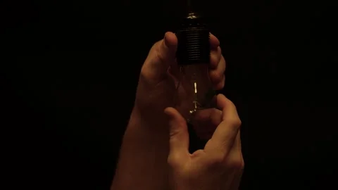 Electrician installing lamp in socket, close-up Stock Footage 263717773