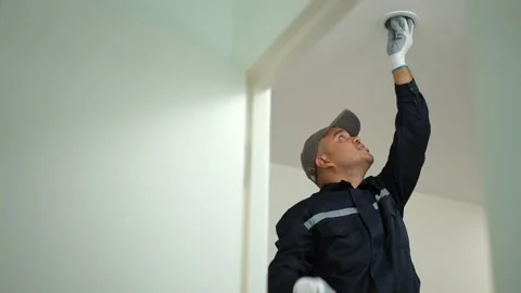 Electrician installing led light bulbs at home for power saving. Fixing changing 库存影片 234262273