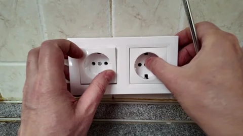Electrician installing a new wall socket closeup video Stock Footage 312812536