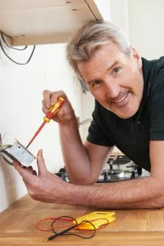 Electrician Installing Socket In New House Stock Photos