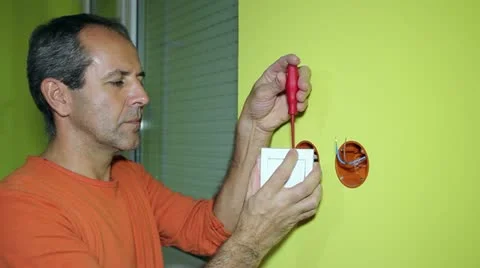 Electrician Installing Switch on the Wall Stock Footage 22002475