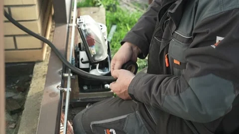 Electrician isolates the electrical wire with protective tape Stock Footage 261178323