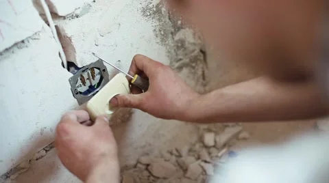 The electrician makes the electrical outlet Stock Footage 61652558