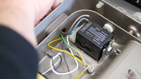 Electrician man pulling out electrical cord Stock Footage 88408947