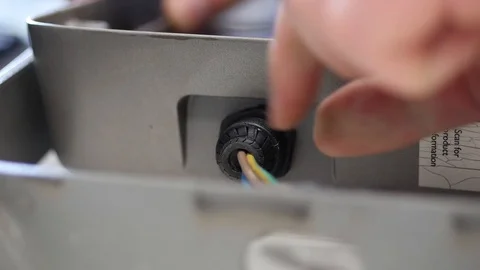 Electrician man pulling out electrical cord Stock Footage 88408964