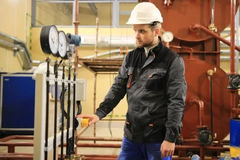 Electrician operator inspect and checking heating ventilated and air conditio Stock Photos