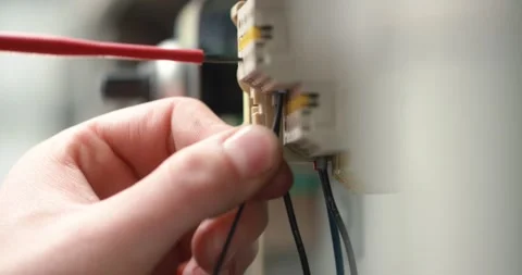 Electrician plugging in a cable Stock Footage 133229891
