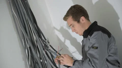 Electrician preparing electric system in house under construction Video stock 45653980