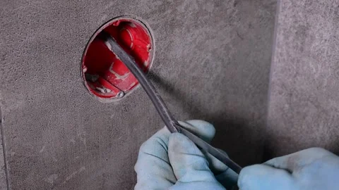 Electrician removing cable insulation with utility knife Stock Footage 304117133