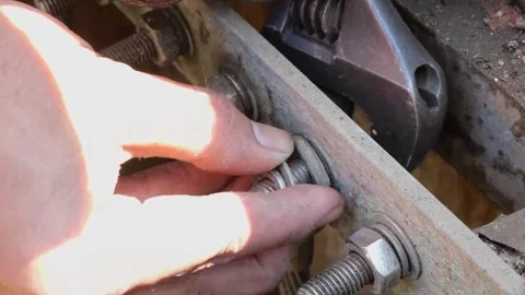 Electrician Removing Grounding Wire from Bus Bar for Resistance Measurement Stock Footage 297919359