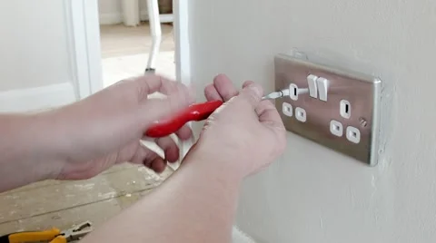 Electrician: removing a UK plug wall socket Stock Footage 45192501