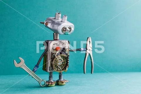 Electrician robot handyman wrench pliers. Mechanic cyborg toy lamp bulb eyes Stock Photos
