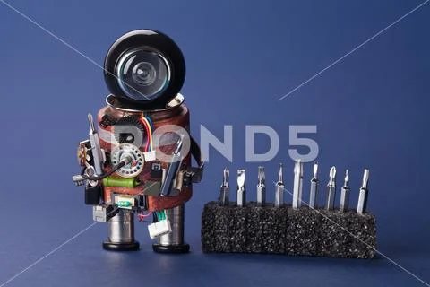 Electrician robot with screwdriver set. Fun service character, black helmet head Stock Photos