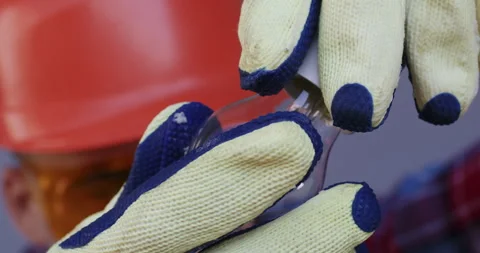 An electrician screws a light bulb into the socket, Stock Footage 254725031