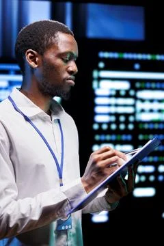 Electrician in server facility Stock Photos