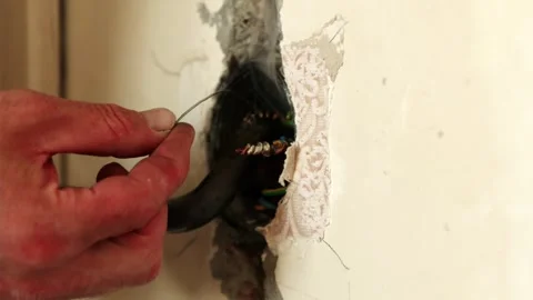 Electrician soldering electrical wire connection with hot iron Stock Footage 339298330