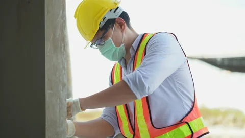 Electrician technician  wearing protective face mask working in construction Stock Footage 146445270