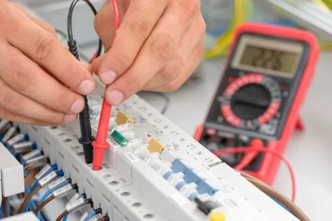 Electrician Testing an Electric Smart Panel Stock Photos