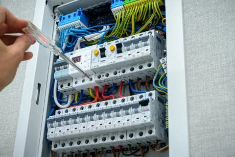 Electrician testing the electrical shield. Electrical panel Stock-Fotos