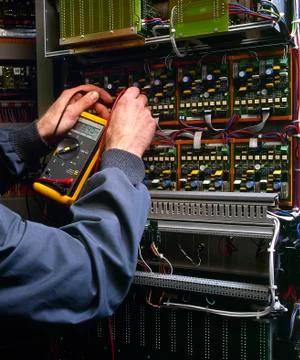 Electrician testing industrial machine Stock Photos