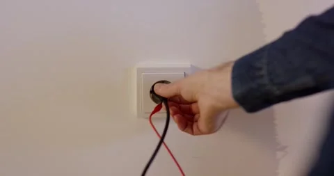 Electrician Testing a Power Socket with Multimeter Probes, Close Up Interior Vídeo Stock 341326976