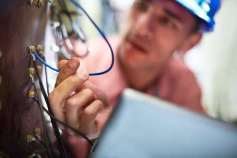 Electrician testing wires Stockfoto's